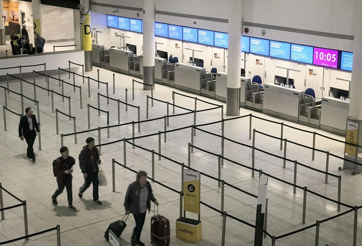 Empty check-in desks at Gatwick Airport after Monarch Airlines collapsed into administration (Lauren Hurley/PA)