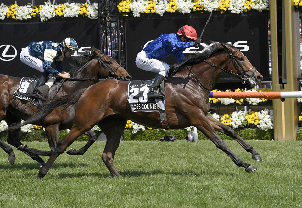 In this Tuesday, Nov. 6, 2018, file photo, Cross Counter with jockey Kerrin McEvoy on board, right, wins the Melbourne Cup ahead of second placed Marmelo, left, at Flemington Racecourse in Melbourne, Australia. English stayer Cross Counter gave Dubai-based Godolphin stables its first Melbourne Cup with a length victory in Australia's largest and most prestigious horse race on Tuesday.(AP Photo/Andy Brownbill, File)