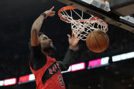 Toronto Raptors guard Kobi Simmons (8) dunks the ball during first half of an NBA basketball game against the Philadelphia 76ers, in Toronto, Sunday, March 31, 2024. (Frank Gunn/The Canadian Press via AP)