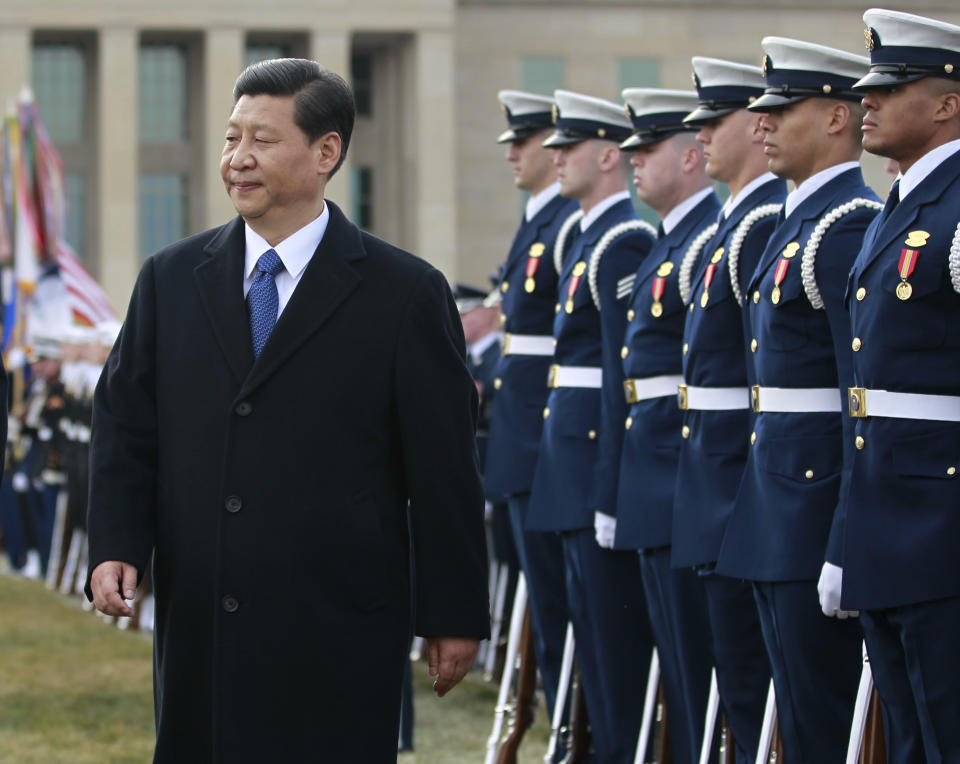 Chinese Vice President Xi Jinping reviews the troops during a full honors ceremony in his honor, Tuesday, Feb. 14, 2012, at the Pentagon.   (AP Photo Manuel Balce Ceneta)