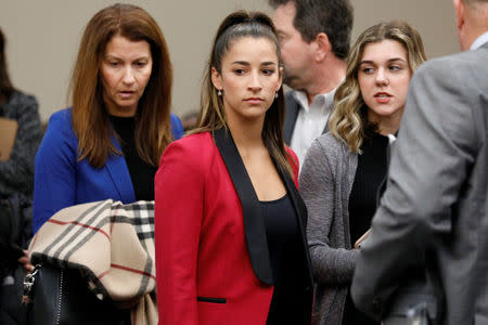 Victim and former gymnast Aly Raisman appears before speaking at the sentencing hearing for Larry Nassar, a former team USA Gymnastics doctor who pleaded guilty in November 2017 to sexual assault charges, in Lansing, Michigan, U.S., January 19, 2018. REUTERS/Brendan McDermid