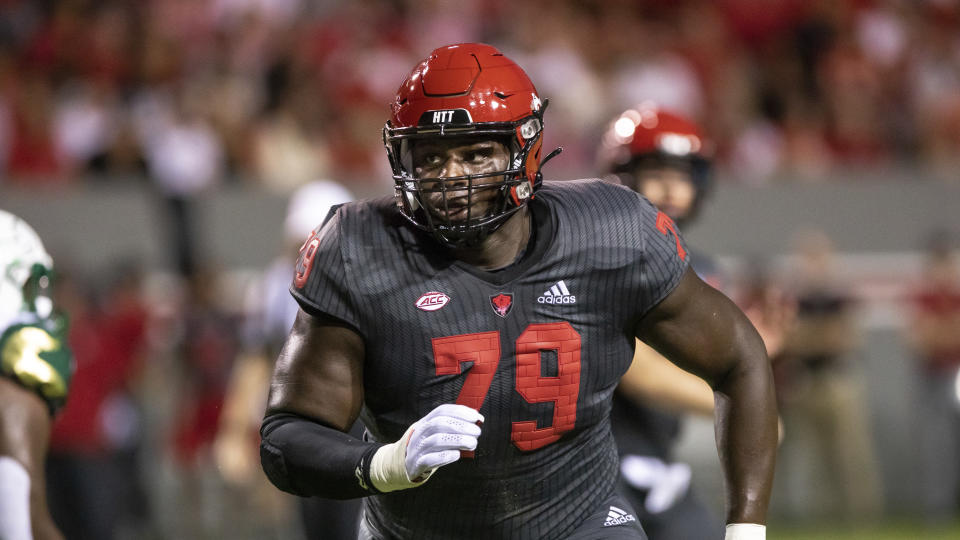 North Carolina State OT Ikem Ekwonu (79) pulls to block during during — and you had better not get in his way. (AP Photo/Ben McKeown)