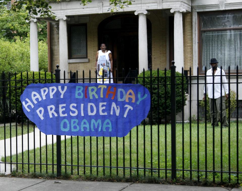 A sign wishing President Barack Obama happy birthday hangs on a neighbor's fence near his Hyde Park home, Sunday, Aug. 12, 2012, in Chicago. President Obama's birthday was Aug. 4. (AP Photo/Carolyn Kaster)