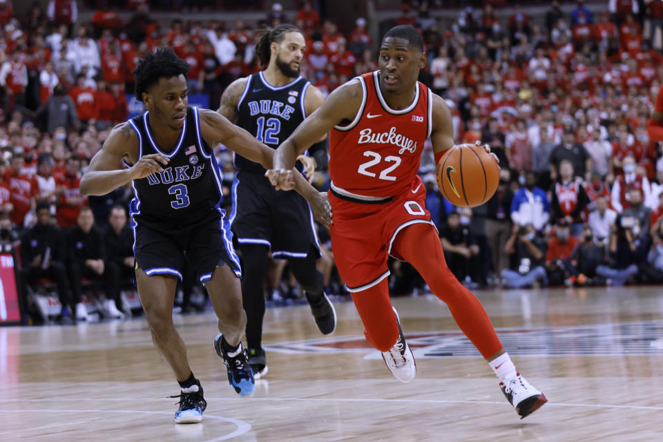 Ohio State's Malaki Branham, right, drives to the basket against Duke's Jeremy Roach during the second half of an NCAA college basketball game Tuesday, Nov. 30, 2021, in Columbus, Ohio. (AP Photo/Jay LaPrete)