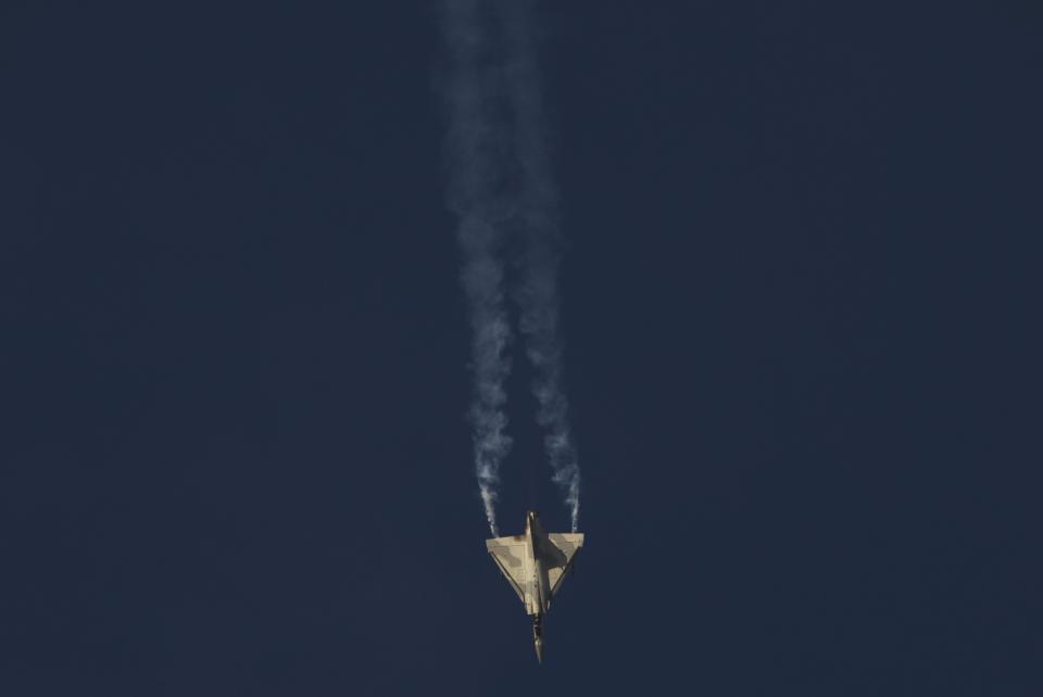 An Emirati Air Force Mirage 2000-9 fighter jet flies at the Dubai Air Show in Dubai, United Arab Emirates, Monday, Nov. 13, 2023. Long-haul carrier Emirates opened the Dubai Air Show with a $52 billion purchase of Boeing Co. aircraft, showing how aviation has bounced back after the groundings of the coronavirus pandemic, even as Israel's war with Hamas clouds regional security. (AP Photo/Jon Gambrell)