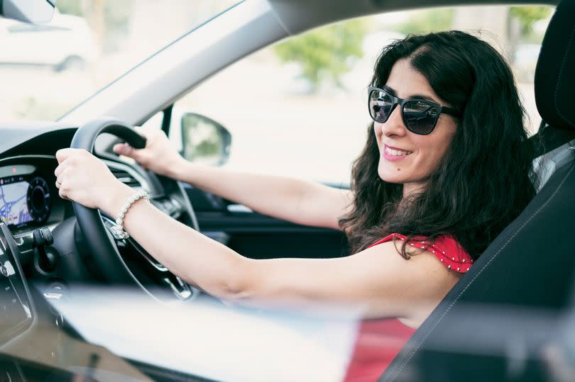 Many drivers wear sunglasses on the road - but they could be hit with a huge fine (STOCK IMAGE)