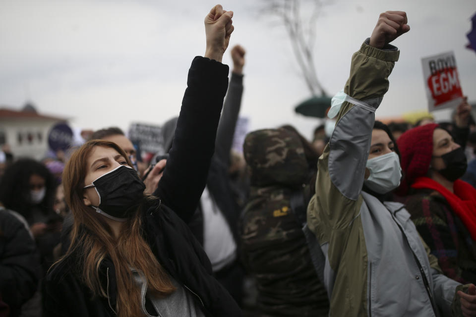 Protesters chat slogans during a rally in Istanbul, Saturday, March 2021, 2021. Turkey's President Recep Tayyip Erdogan's overnight decree annulling Turkey's ratification of the Istanbul Convention is a blow to women's rights advocates, who say the agreement is crucial to combating domestic violence. Turkey was the first country to sign 10 years ago and that bears the name of its largest city. (AP Photo/Emrah Gurel)