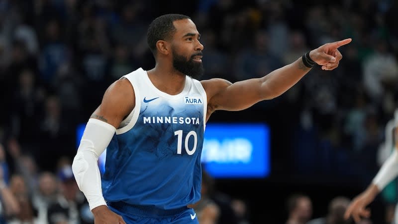 Minnesota Timberwolves guard Mike Conley points after making a basket during game against the San Antonio Spurs, Tuesday, Feb. 27, 2024, in Minneapolis. The former Utah Jazz guard is providing valued leadership for the Timberwolves this season.