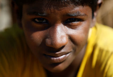 Anwar Hossain, 12, a Rohingya refugee boy, sits outside his temporary shelter at Kutupalong refugee camp near Cox's Bazar, Bangladesh, November 12, 2017. REUTERS/Navesh Chitrakar