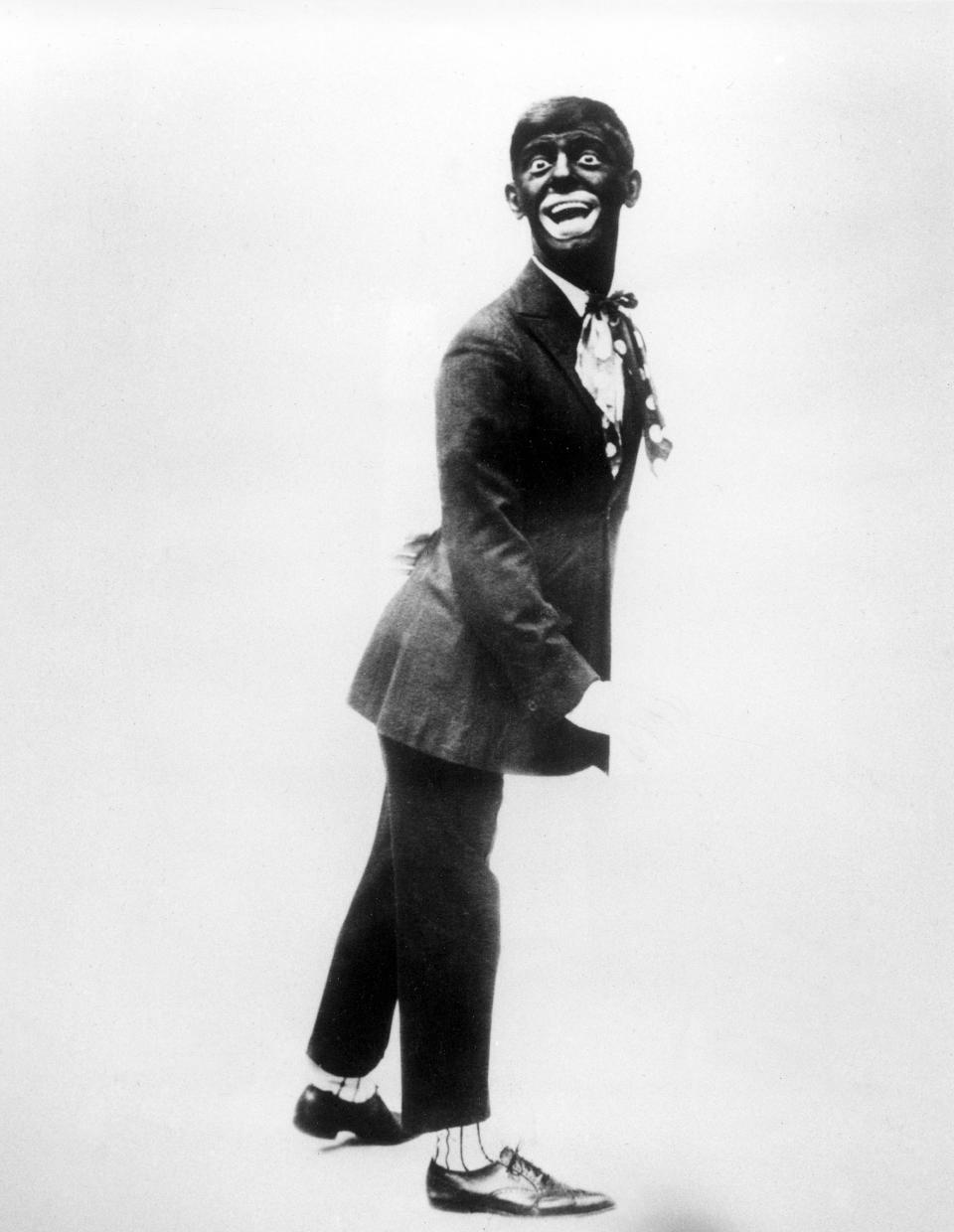 This 1920s image shows comedian Eddie Cantor wearing blackface while performing "If You Knew Susie." Historically, blackface emerged in the mid-19th century, representing a combination of put-down, fear and morbid fascination with black culture. Among the most prominent examples: Al Jolson and Eddie Cantor. Today, there’s a fine line between mockery and tribute. (AP Photo, File)