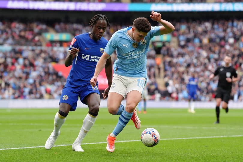 Chelsea and Manchester City players battle for the ball