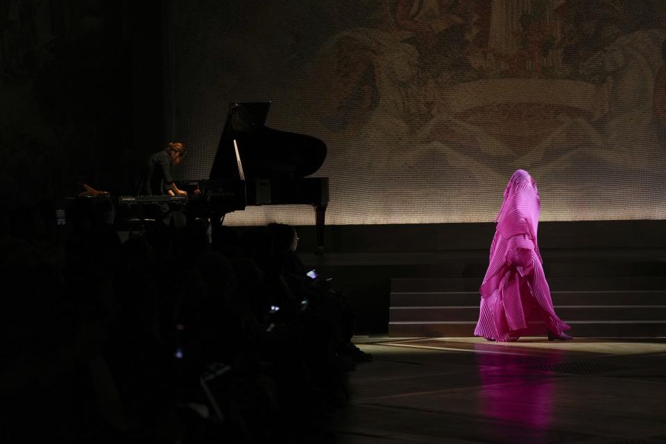 A model wears a creation as part of the Issey Miyake Fall/Winter 2024-2025 ready-to-wear collection presented Friday, March 1, 2024 in Paris. (Photo by Scott A Garfitt/Invision/AP)