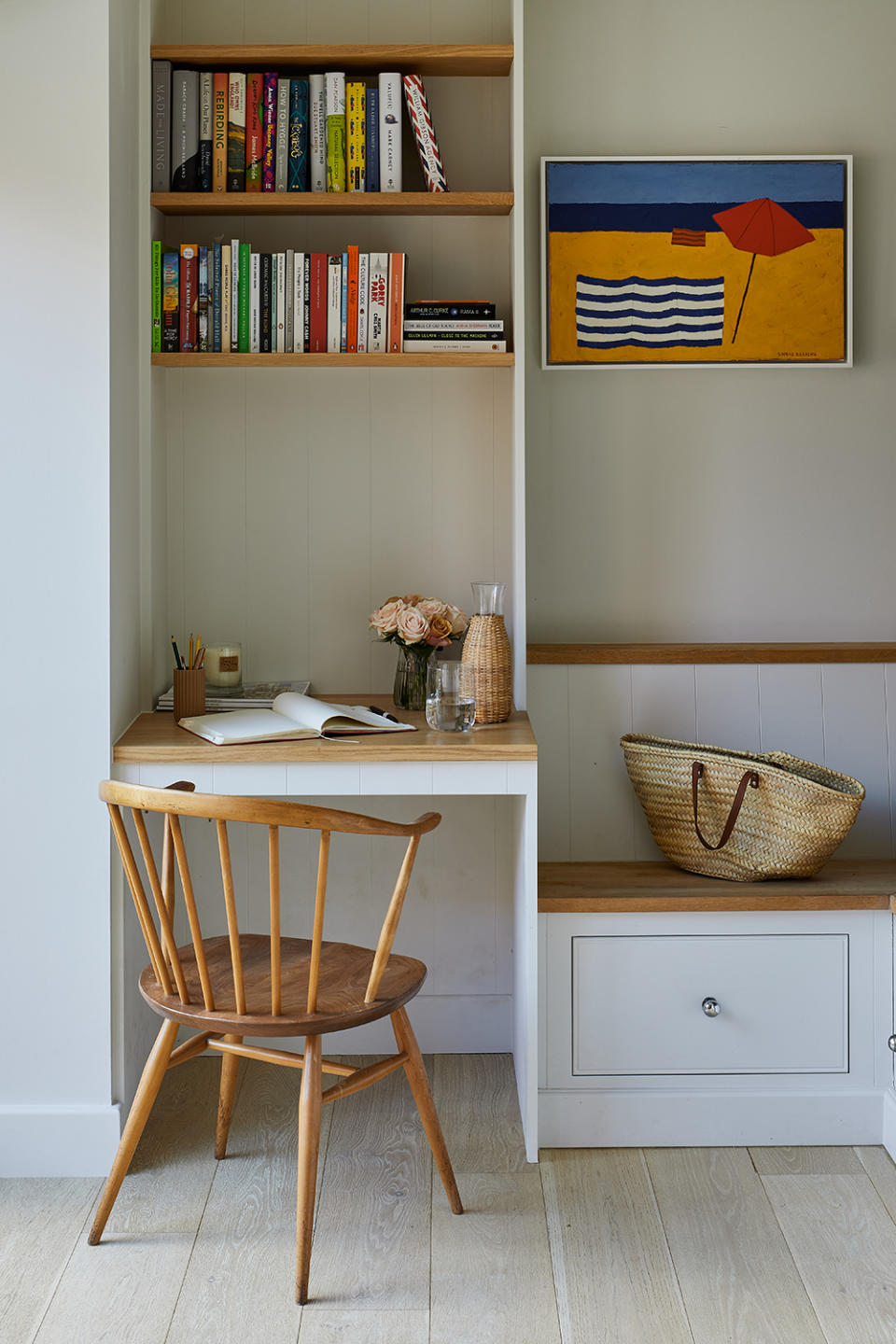 entryway with built in seating and desk