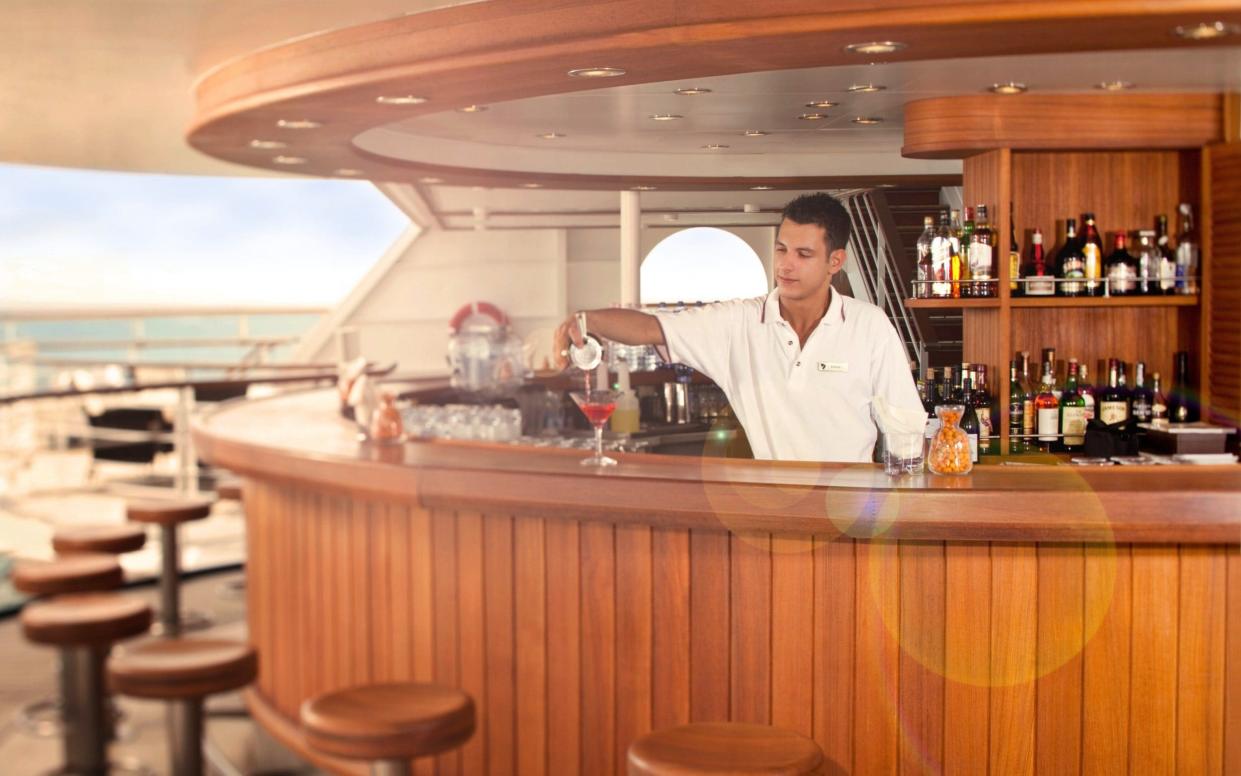 Bartender serves drinks on a cruise