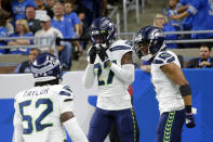 Seattle Seahawks cornerback Tariq Woolen celebrates his interception return for a touchdown during the second half of an NFL football game against the Detroit Lions, Sunday, Oct. 2, 2022, in Detroit. (AP Photo/Duane Burleson)