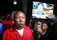 Economic Freedom Fighters (EFF) leader Julius Malema leaves the parliament after being ordered to do so during President Jacob Zuma's State of the Nation address in Cape Town, February 11, 2016. REUTERS/Mike Hutchings