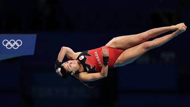 Canada's Meaghan Benfeito competes in women's 10-metre platform diving preliminaries at the Tokyo Olympics on Wednesday in Japan. Benfeito qualified for the semifinal with her performance. (Marko Djurica/Reuters - image credit)