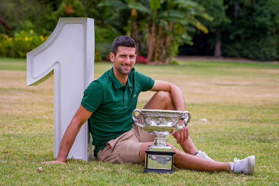 Novak Djokovic of Serbia poses with the Norman Brookes Challenge Cup at the Government House after winning the 2023 Australian Open