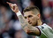 Leverkusen's Robert Andrich gestures during the German Bundesliga Soccer match between Eintracht Frankfurt and Bayer Leverkusen in Frankfurt, Germany, Sunday, May 5, 2024. Left Leverkusen's Granit Xhaka who scored the first goal. (AP Photo/Michael Probst)