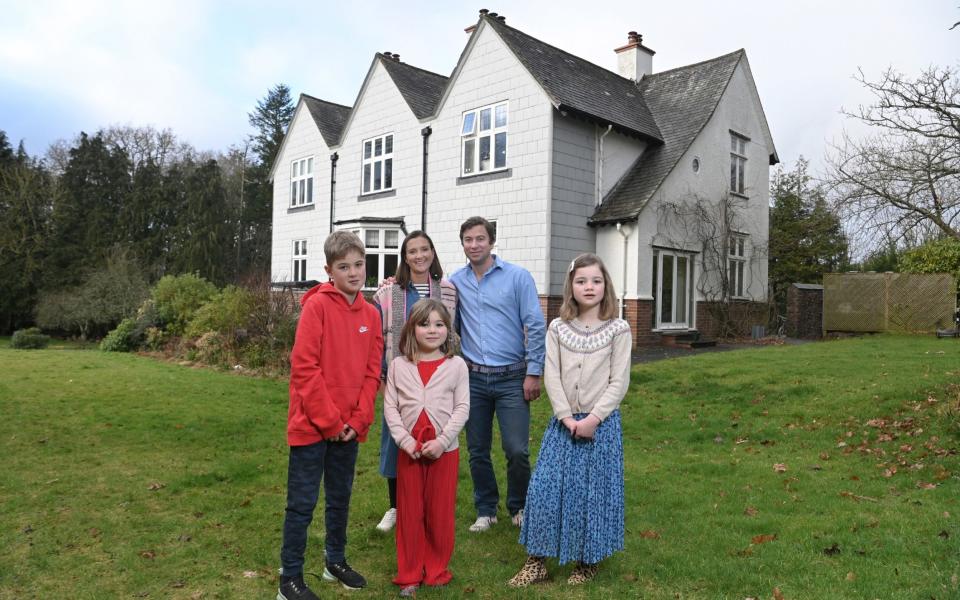 Pix show Jo Saunders, her husband Charlie Saunders and children Max (11, in red fleece),Molly (8, in blue skirt) and Mary (5, in red trousers) at their country home in Cove, Devon.Pix Jay Williams 15-02-23 - Jay Williams