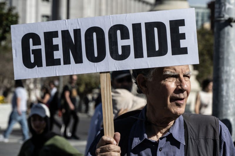Genocide is the simple message on the sign of a demonstrator for Palestine and Gaza in front of City Hall in San Francisco on Saturday. Photo by Terry Schmitt/UPI