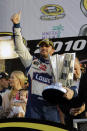 FILE - In this Nov. 21, 2010, file photo, NASCAR driver Jimmie Johnson celebrates after winning his fifth Sprint Cup Series Championship, in Homestead, Fla. Jimmie Johnson is the latest NASCAR superstar to climb out of his car, with the seven-time champion announcing Wednesday, Nov. 20, 2019, that 2020 will be his final season of full-time racing. (AP Photo/Terry Renna, File)