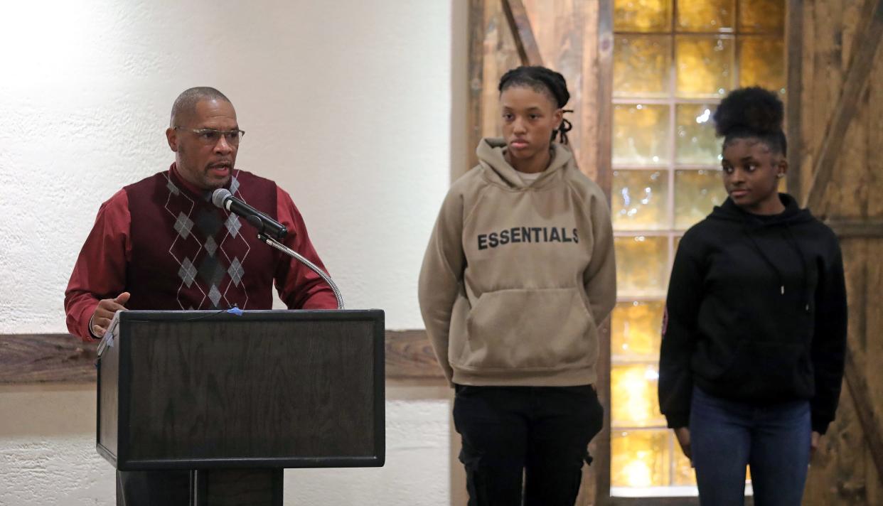 Firestone girls basketball coach Eric Mitchell, left, introduces Aalivia Mullins and Kiara Smith during the Akron City Series high school basketball media day at Guy's Party Center on Tuesday in Akron.