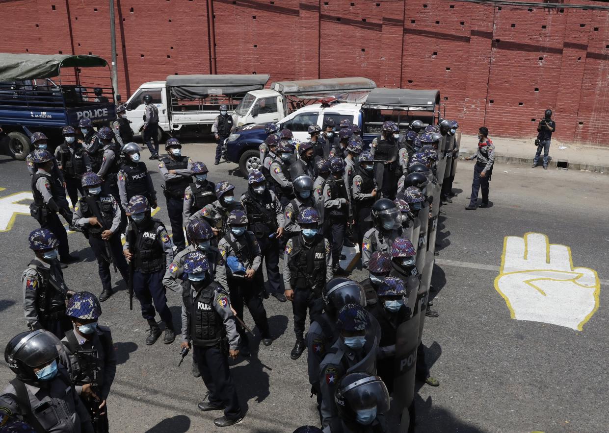 <p>Anti-riot police officers deployed in Yangon, Myanmar on 25 February</p> (EPA)