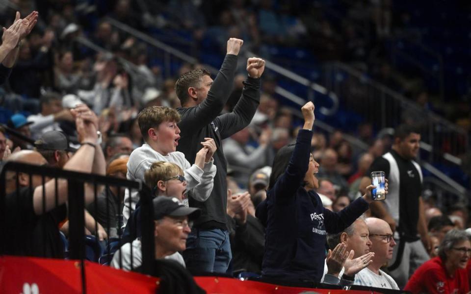 Fans cheer for Beau Bartlett during the U.S. Olympic Team Trials for wrestling at the Bryce Jordan Center on Friday, April 19, 2024.  