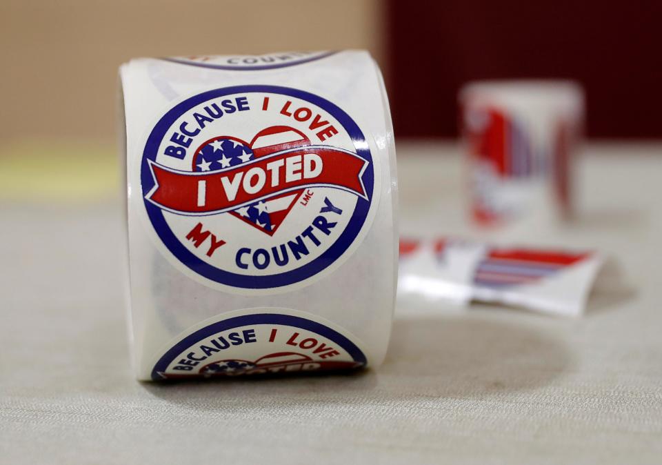 "I voted" stickers sit on a table the Salvation Army of Green Bay polling location on Nov. 8, 2022 in Green Bay, Wis.