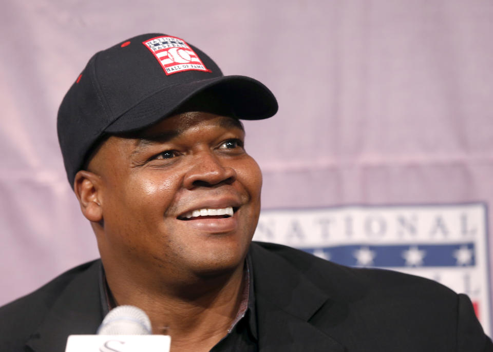 Chicago White Sox slugger Frank Thomas smiles as he listens to a question during a news conference about his selection into the MLB Baseball Hall Of Fame Wednesday, Jan. 8, 2014, at U.S. Cellular Field in Chicago. Thomas joins Greg Maddux and Tom Glavine as first ballot inductees Wednesday, and will be inducted in Cooperstown on July 27 along with managers Bobby Cox, Joe Torre and Tony La Russa, elected last month by the expansion-era committee. (AP Photo/Charles Rex Arbogast)