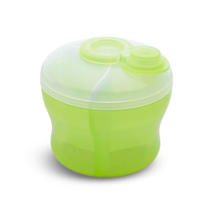 A green portable manual salad spinner against a white background