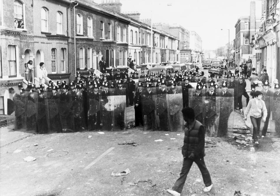 Police on the streets of Brixton during the riots in 1981