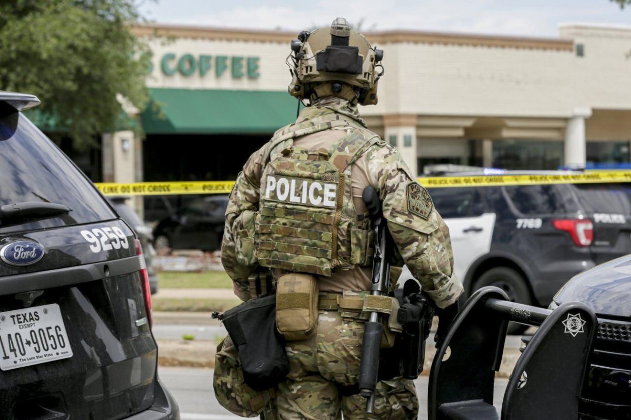 Austin police, SWAT and medical personnel respond to an active shooter situation located at Great Hills Trail in Northwest Austin, Texas on Sunday, April 18, 2021. Emergency responders say several people have been fatally shot in Austin and that no suspect is in custody.