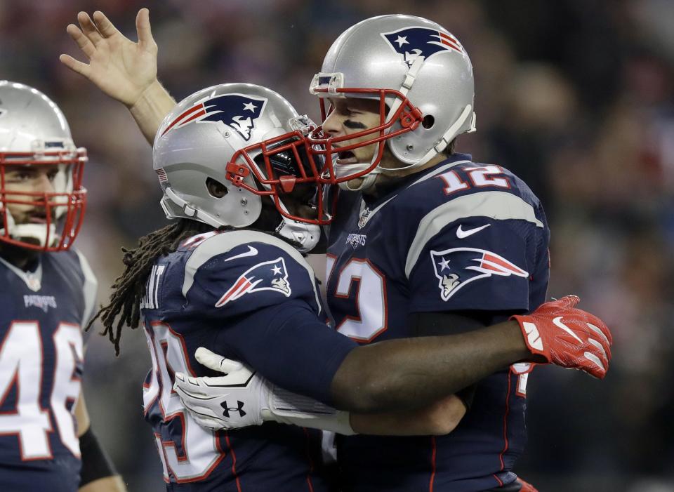 Tom Brady, right, bailed out the mistake-prone Patriots in a 30-23 win over the Ravens. (AP) 