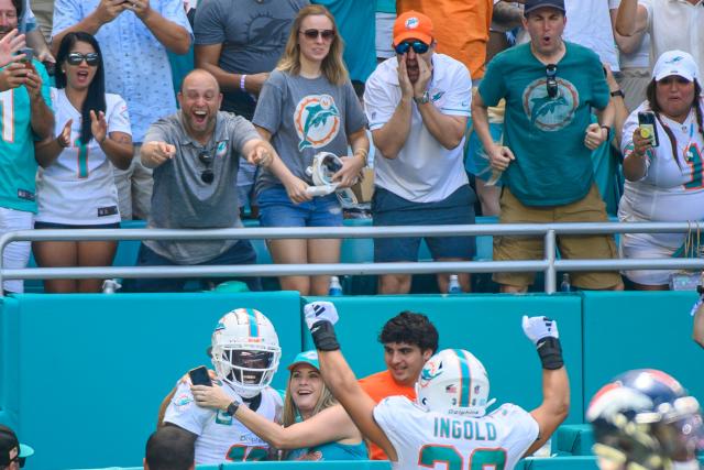 The Miami Dolphins celebrate after scoring a touchdown during the