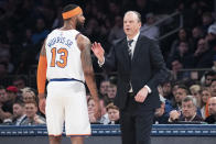 New York Knicks head coach Mike Miller, right, talks to forward Marcus Morris Sr. (13) in the first half of an NBA basketball game against the Philadelphia 76ers, Saturday, Jan. 18, 2020, at Madison Square Garden in New York. (AP Photo/Mary Altaffer)