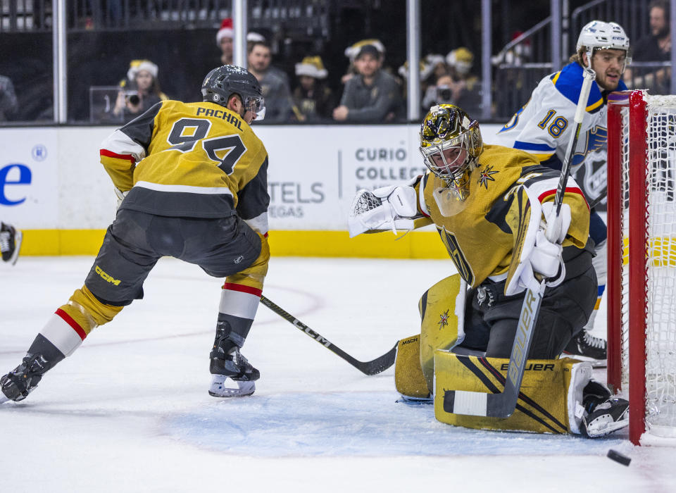 Vegas Golden Knights goaltender Logan Thompson (36) stops a St. Louis Blues shot during the first period of an NHL hockey game Friday, Dec. 23, 2022, in Las Vegas. (AP Photo/L.E. Baskow)