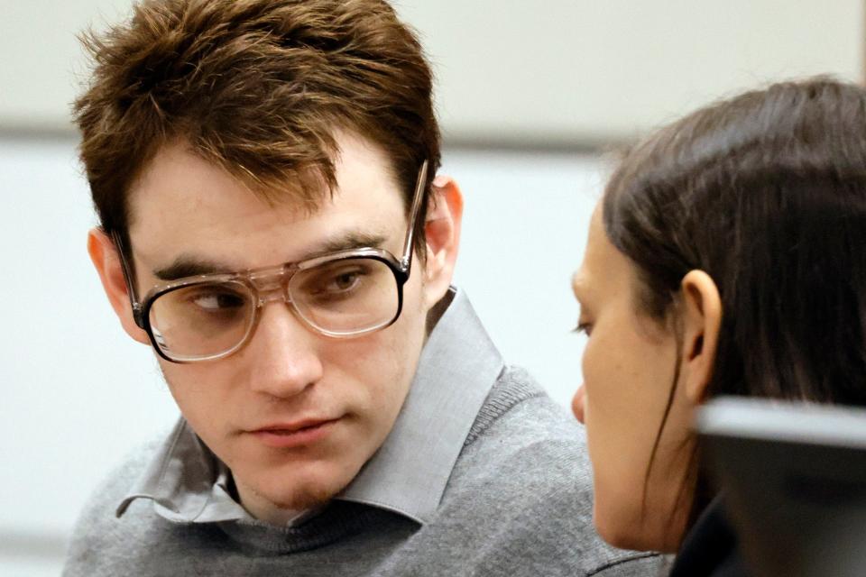 Marjory Stoneman Douglas High School shooter Nikolas Cruz speaks with sentence mitigation specialist Kate O'Shea, a member of the defense team, during the penalty phase of Cruz’s trial at the Broward County Courthouse in Fort Lauderdale on Tuesday, August 30, 2022. Cruz previously plead guilty to all 17 counts of premeditated murder and 17 counts of attempted murder in the 2018 shootings.