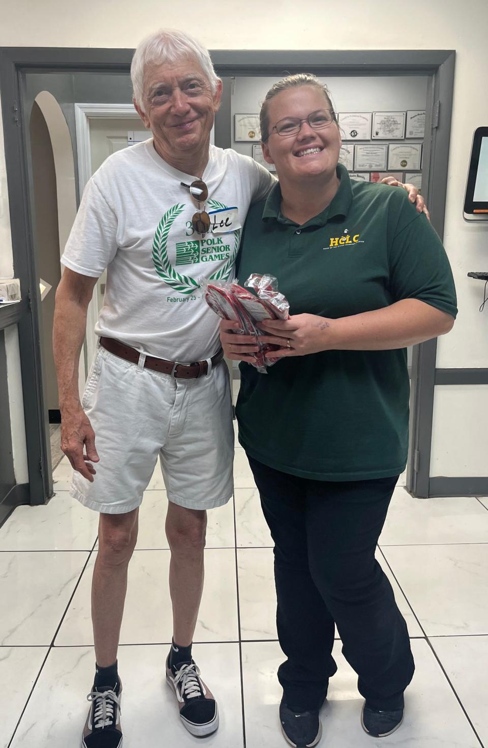 Leander Aulisio, left, coordinator of the Polk County Chapter of Moms Demand Action, delivers a batch of gun locks to Shara Sowell, Director of Head-of-the-Class Learning Center. Aulisio's organization is collaborating with the League of Women Voters of Polk County,