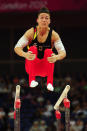 LONDON, ENGLAND - JULY 28: Marcel Nguyen of Germany competes in the parallel bars in the Artistic Gymnastics Men's Team qualification on Day 1 of the London 2012 Olympic Games at North Greenwich Arena on July 28, 2012 in London, England. (Photo by Mike Hewitt/Getty Images)