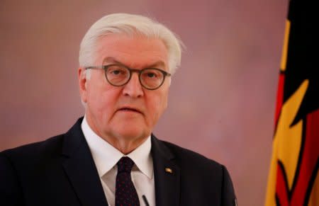 FILE PHOTO - German President Frank-Walter Steinmeier gives a statement after a meeting with Chancellor Angela Merkel, as coalition government talks collapsed in Berlin, Germany, November 20, 2017. REUTERS/Axel Schmidt