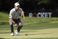 Kevin Kisner eyes his putt on the ninth green during the first round of the Rocket Mortgage Classic golf tournament Thursday, July 2, 2020, at Detroit Golf Club in Detroit. (AP Photo/Carlos Osorio)