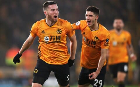 Wolverhampton Wanderers' Matt Doherty (left) celebrates scoring his side's third goal of the game with Ruben Vinagre - Credit: PA