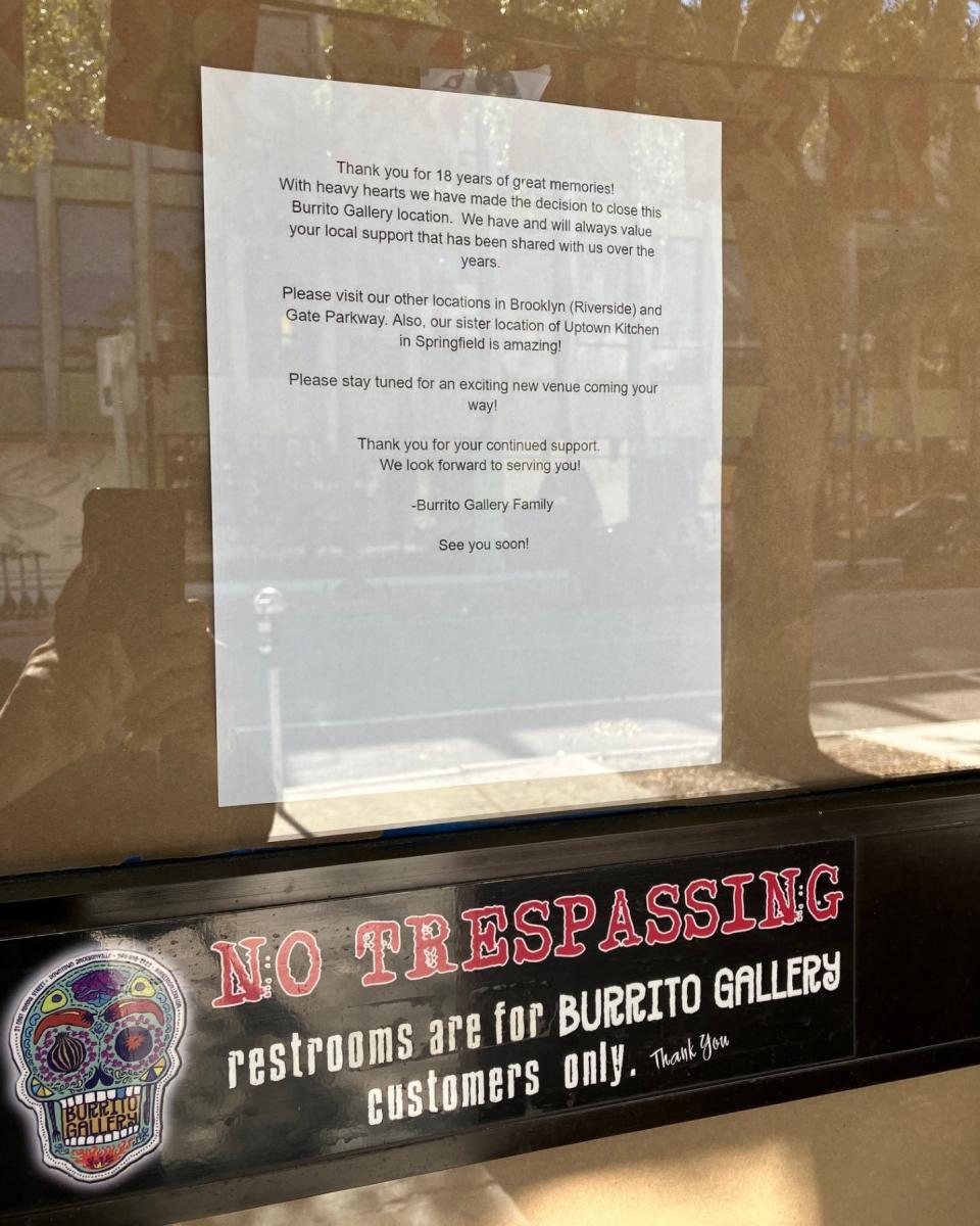 A sign on the door at Burrito Gallery's 21 E. Adams St. restaurant announces its closure on Wednesday.