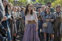 This image released by Lionsgate shows Rachel Zegler, center, in a scene from "The Hunger Games: The Ballad of Songbirds and Snakes." (Lionsgate via AP)