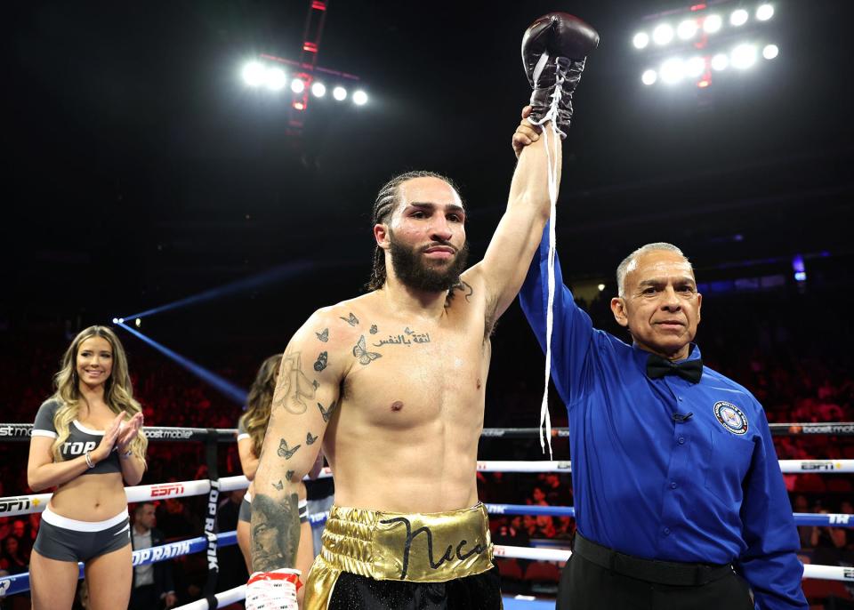 GLENDALE, ARIZONA - FEBRUARY 03: Nico Ali Walsh celebrates after defeating Eduardo Ayala, during their middleweight fight at Desert Diamond Arena on February 03, 2033 in Glendale, Arizona. (Photo by Mikey Williams/Top Rank Inc via Getty Images)