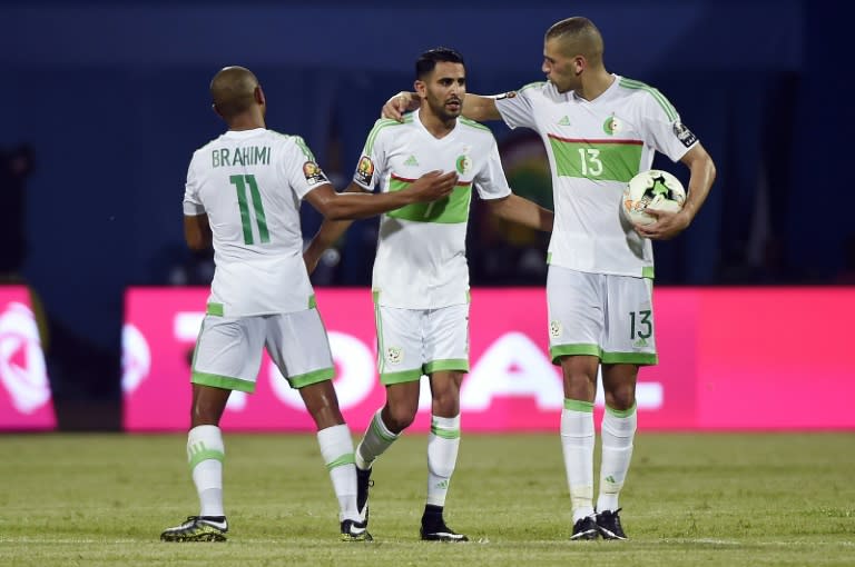 Algeria's forward Riyad Mahrez (C) celebrates with midfielder Yacine Brahimi (R) and forward Islam Slimani after scoring a second goal during the 2017 Africa Cup of Nations group B football match against Zimbabwe in Franceville on January 15, 2017