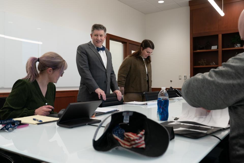 Jeffrey Jackson, second from left, helps coach a constitutional moot court team Tuesday afternoon.