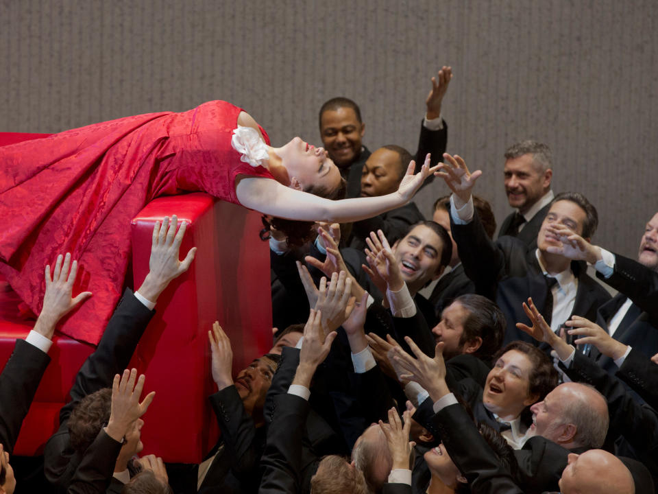 In this March 7, 2013 photo provided by the Metropolitan Opera Diana Damrau performs as Violetta in a scene from scene from Act I of Verdi's "La Traviata" during a rehearsal at the Metropolitan Opera in New York. (AP Photo/ Metropolitan Opera, Ken Howard)